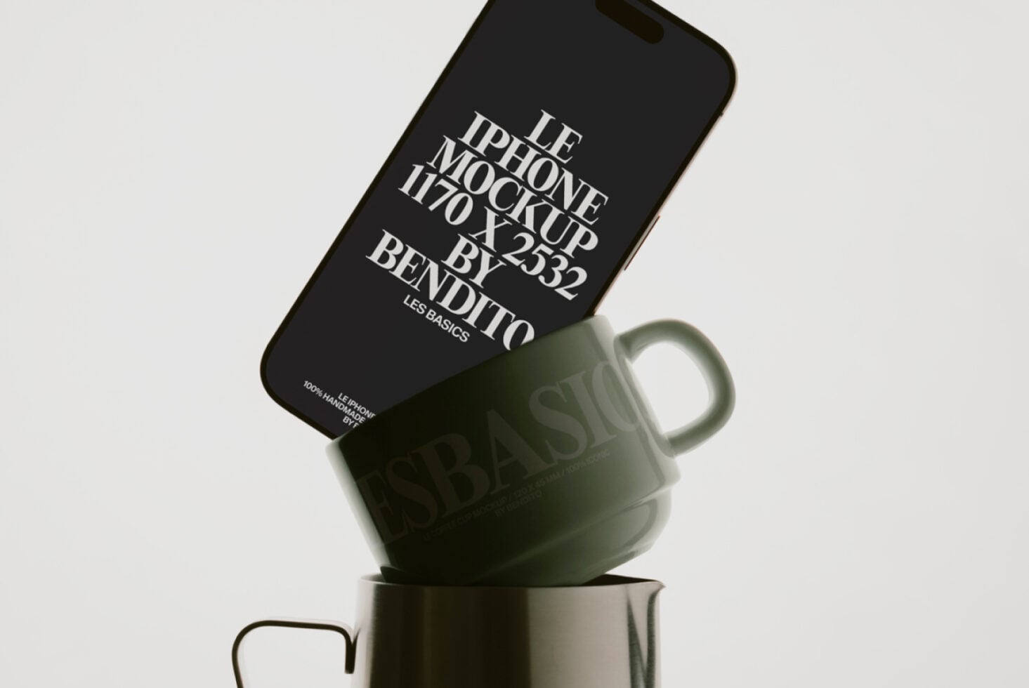Black iPhone balanced on matte green cup displaying typography mockup layout