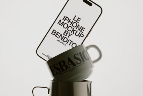 Light phone resting on ceramic mug showing Bendito mockup with curved edges