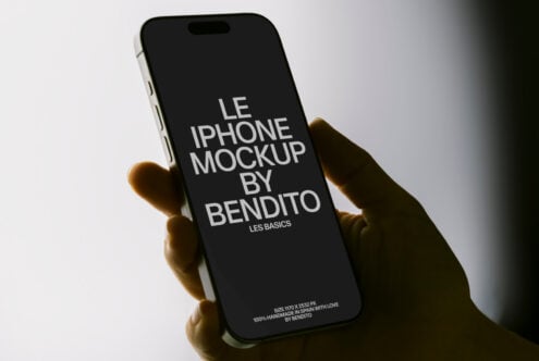 Black iPhone held in hand showing Bendito mockup with white text on dark screen