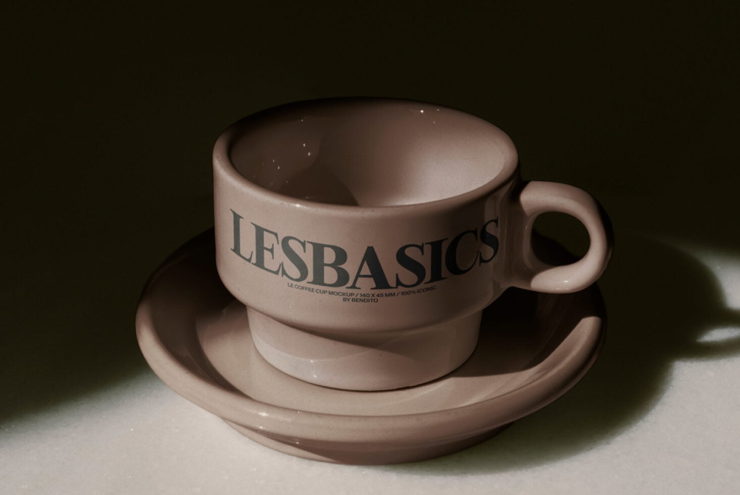 Beige coffee cup with saucer featuring LE BASICS logo in clean typography