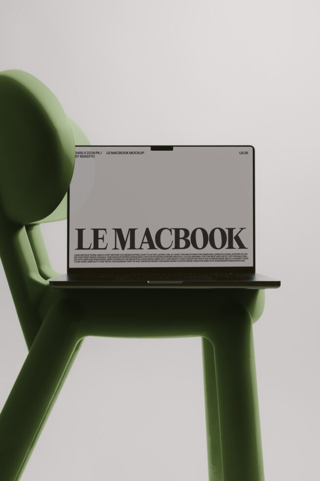 Green sculptural chair holding MacBook with light gray screen mockup visible