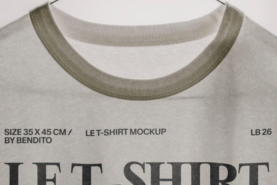 Off-white tee neckline detail with olive ribbed trim