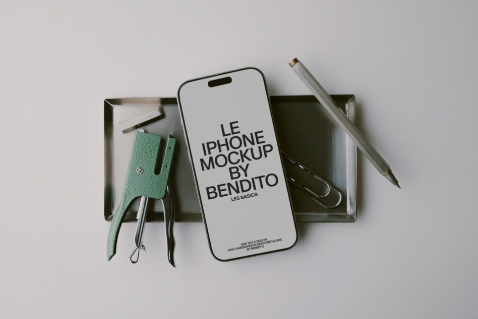 iPhone mockup flat lay with mint green leather phone sleeve, pens, scissors in metal tray