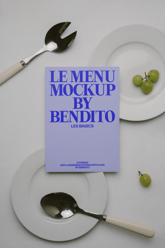 Lavender menu card between white plates with utensils on white surface