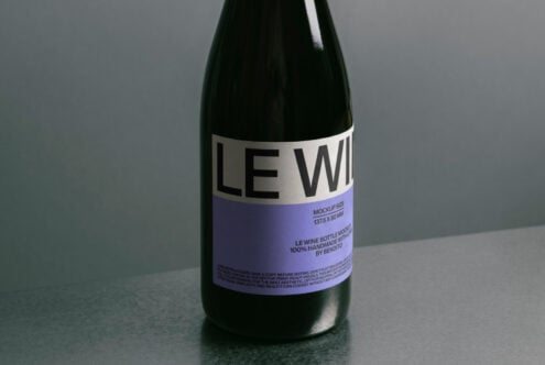 Dark bottle label mockup with purple section showing text details