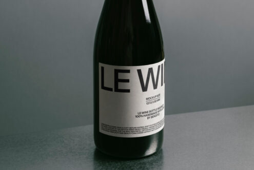 Dark bottle label mockup with beige section showing text details