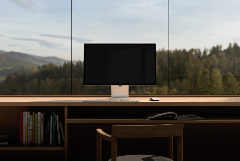 Minimalist workspace mockup with desktop monitor on wooden desk featuring books and an open magazine. Ideal for designers and digital asset presentations.