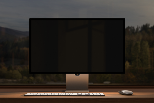 Computer monitor mockup on a wooden desk with keyboard and mouse. Perfect digital assets for designers. Keywords: mockups, templates, desk setup.