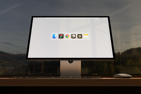 Computer screen displaying app icons on a desktop against a scenic background for mockup design. Keywords: digital, monitor, interface, workspace.
