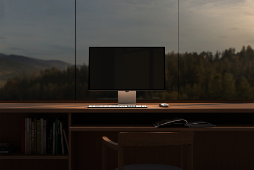 Minimalist workspace mockup featuring a sleek desktop monitor keyboard and mouse on a wooden desk with a scenic forest view perfect for designers