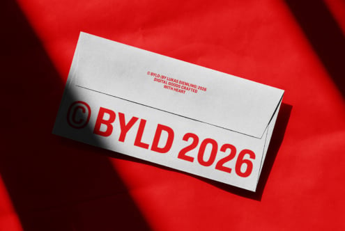 White business envelope mockup with red BYLD 2026 branding on red background