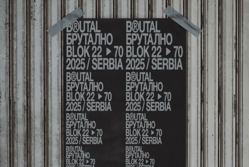 Black poster with white Brutal Brutalno typography grid pattern on metal wall