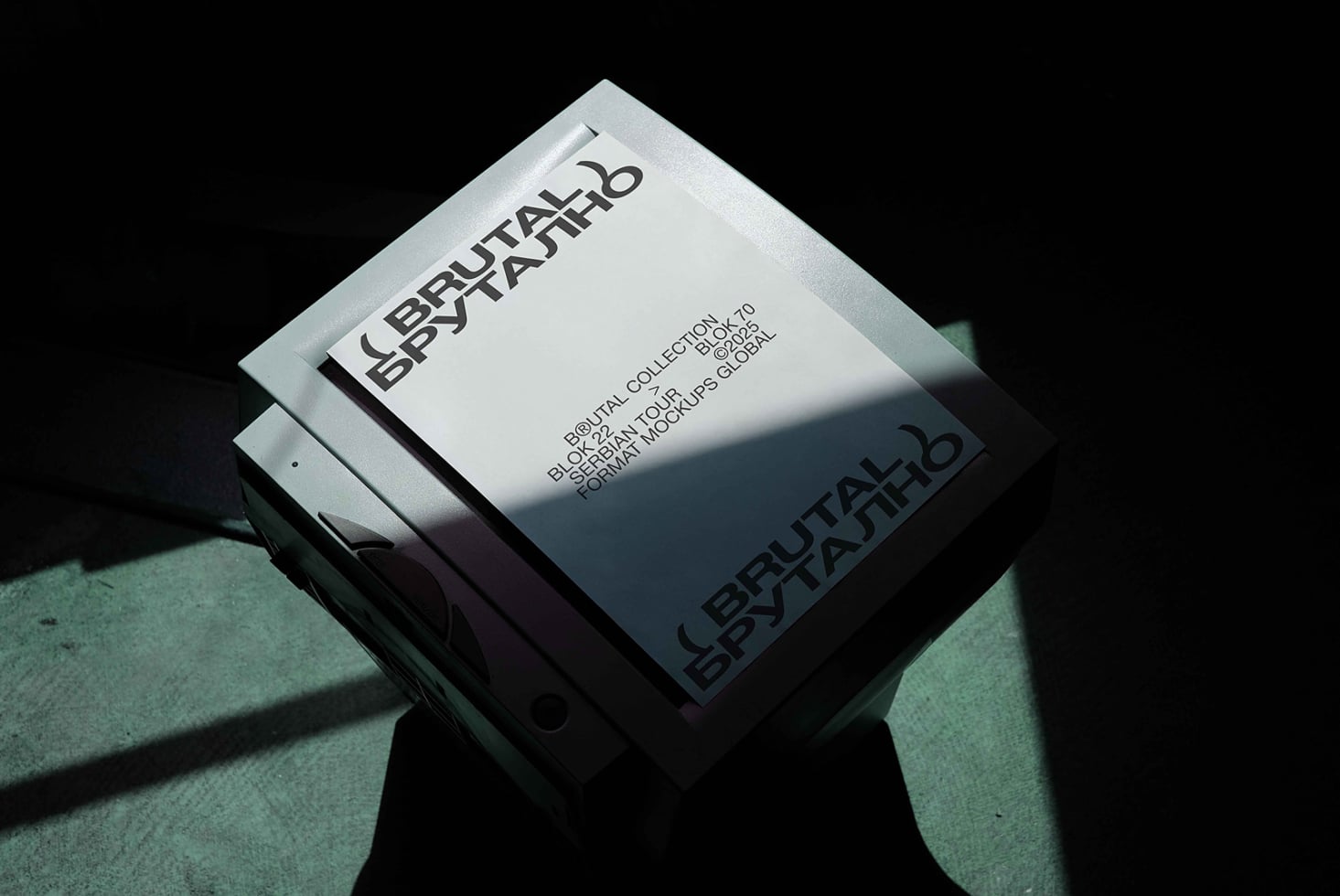 Stacked white boxes with Brutal Brutalno typography in dramatic shadow lighting