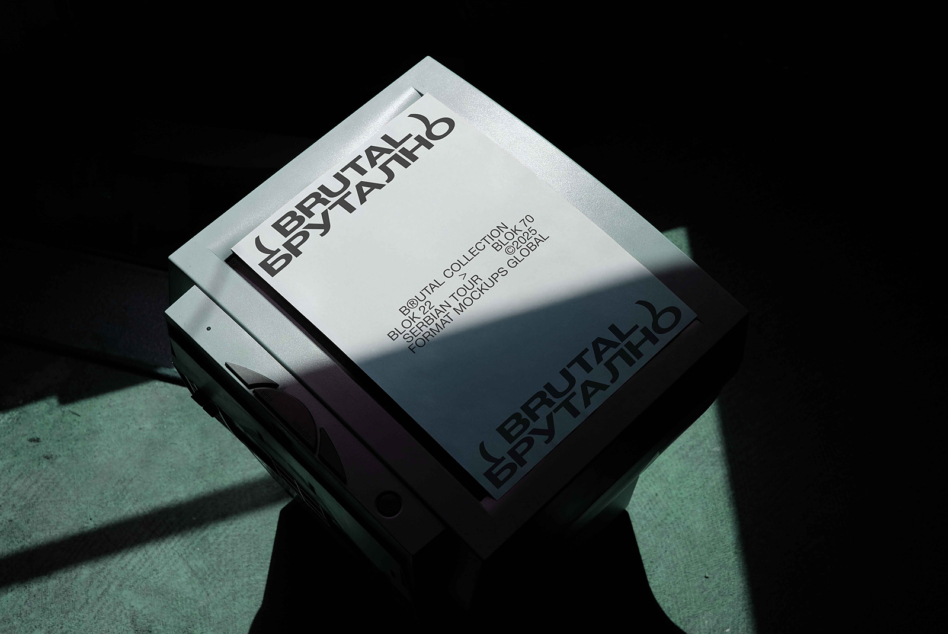Stacked white boxes with Brutal Brutalno typography in dramatic shadow lighting