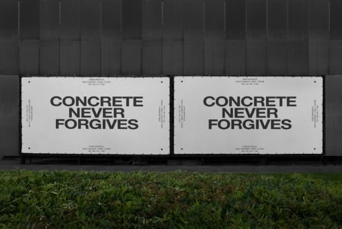 Dual billboard mockup on dark building facade with concrete never forgives typography