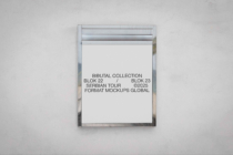 Silver frame mockup on light wall displaying stacked text in minimalist style
