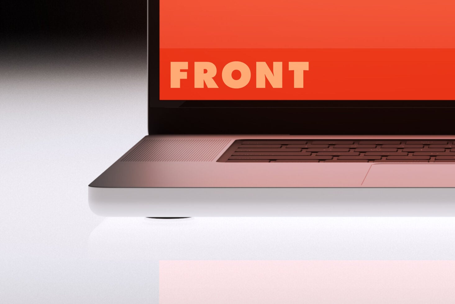 Laptop 3/4 view displaying bright orange mockup surface