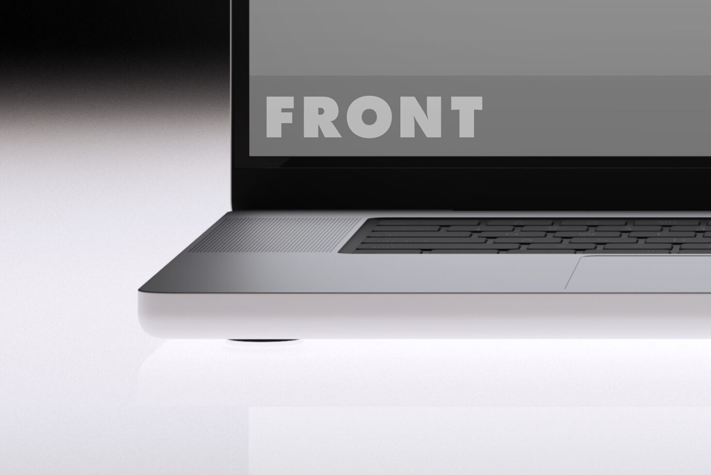 Laptop angled showing neutral toned screen with keyboard detail