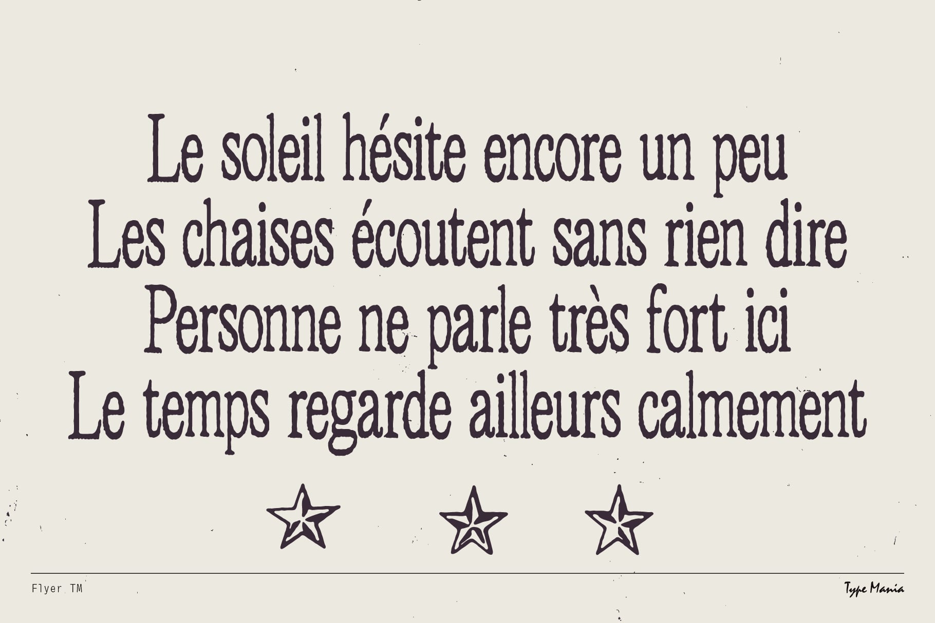 French poetry excerpt in serif typeface with decorative line stars below