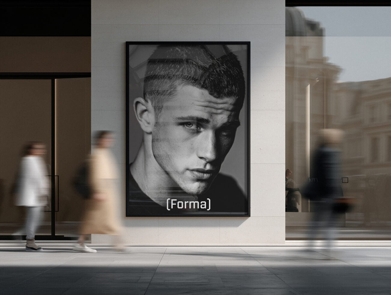 Framed black portrait poster hanging in modern gallery with people walking by