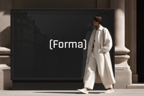 Woman passing large billboard screen with center text flanked by architectural columns on marble floor