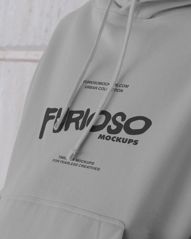 White hoodie detail showing black Furioso text printed on sleeve with tagline text