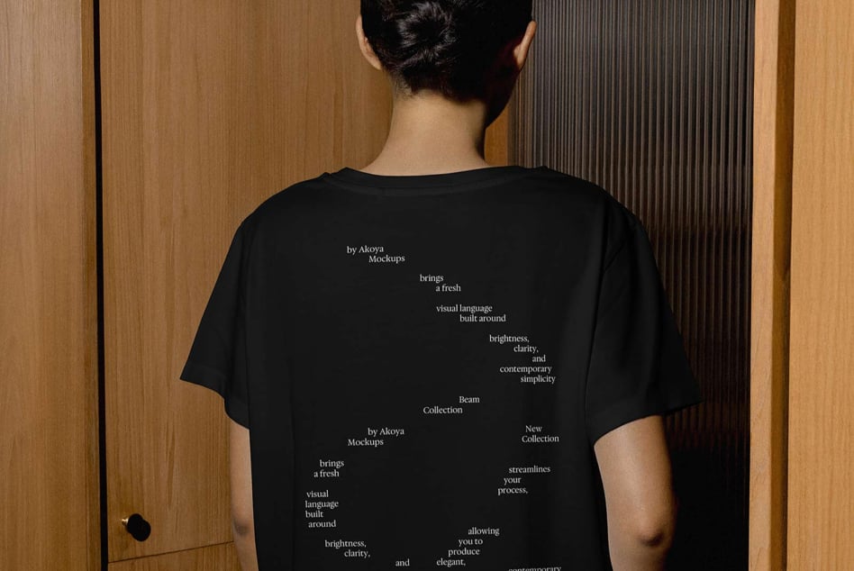 Black tee back view with centered typography layout for Beam Collection