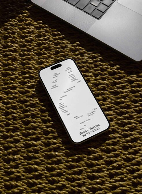 Smartphone mockup on textured fabric showing Beam Collection mobile screen