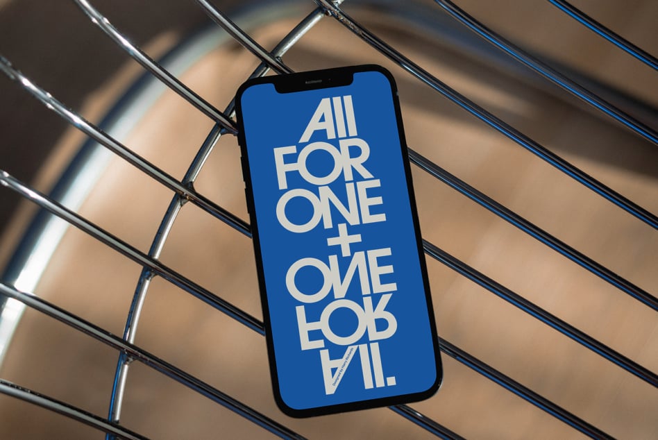 iPhone mockup with bold white typography on bright blue screen against metallic ribbed background