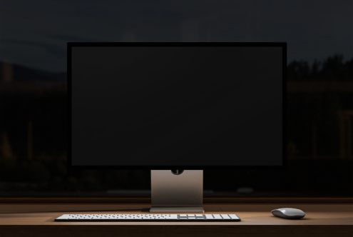 Minimalist desktop mockup featuring a large monitor, keyboard, and mouse on a wooden desk. Perfect for design presentations, digital assets.