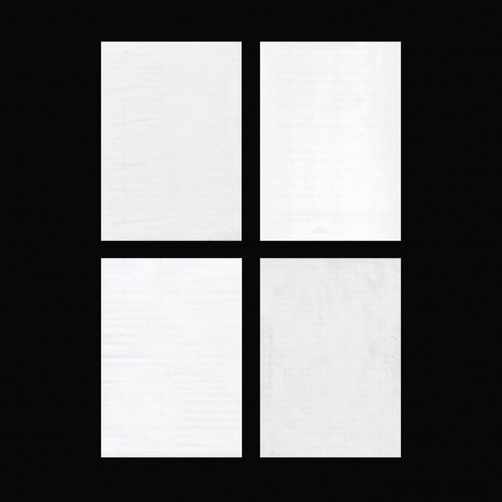 Four blank white poster frames arranged in 2x2 grid on black background
