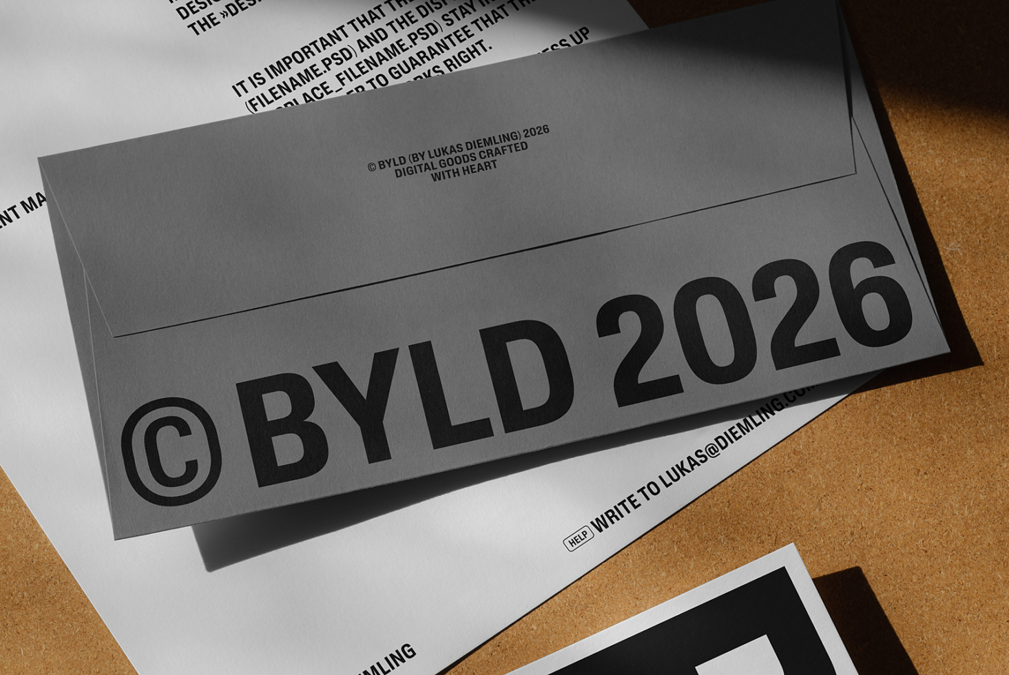 Gray envelope mockup with black BYLD 2026 branding on white surface