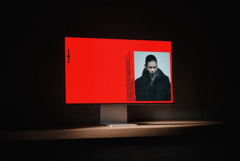 Bright red billboard mockup showing fashion portrait with geometric text layout