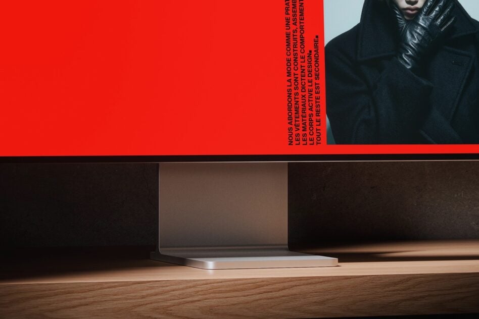 Magazine spread with red background, model in black jacket, vertical French copy overlay