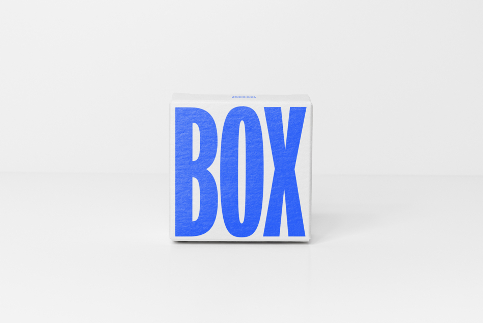 White rectangular box with chunky blue dimensional letters on minimal clean background