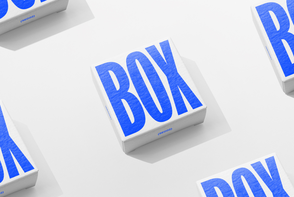 White boxes with textured blue BOX lettering on light gray background