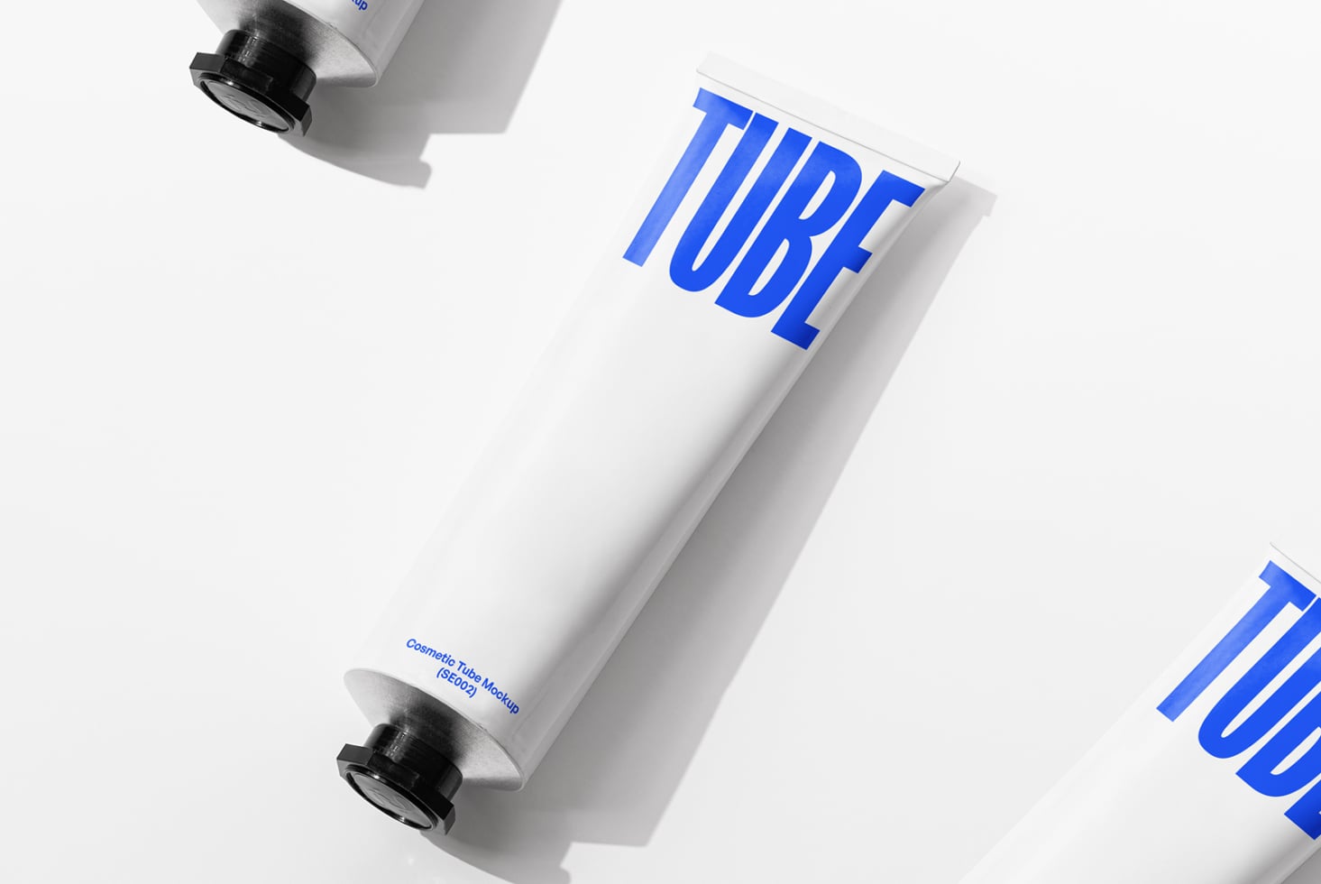 White tube with bright blue TUBE text, black cap, angled against light background