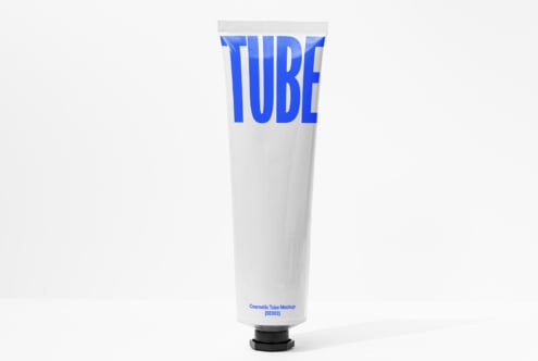 White cosmetic tube mockup with bright blue TUBE text label on front