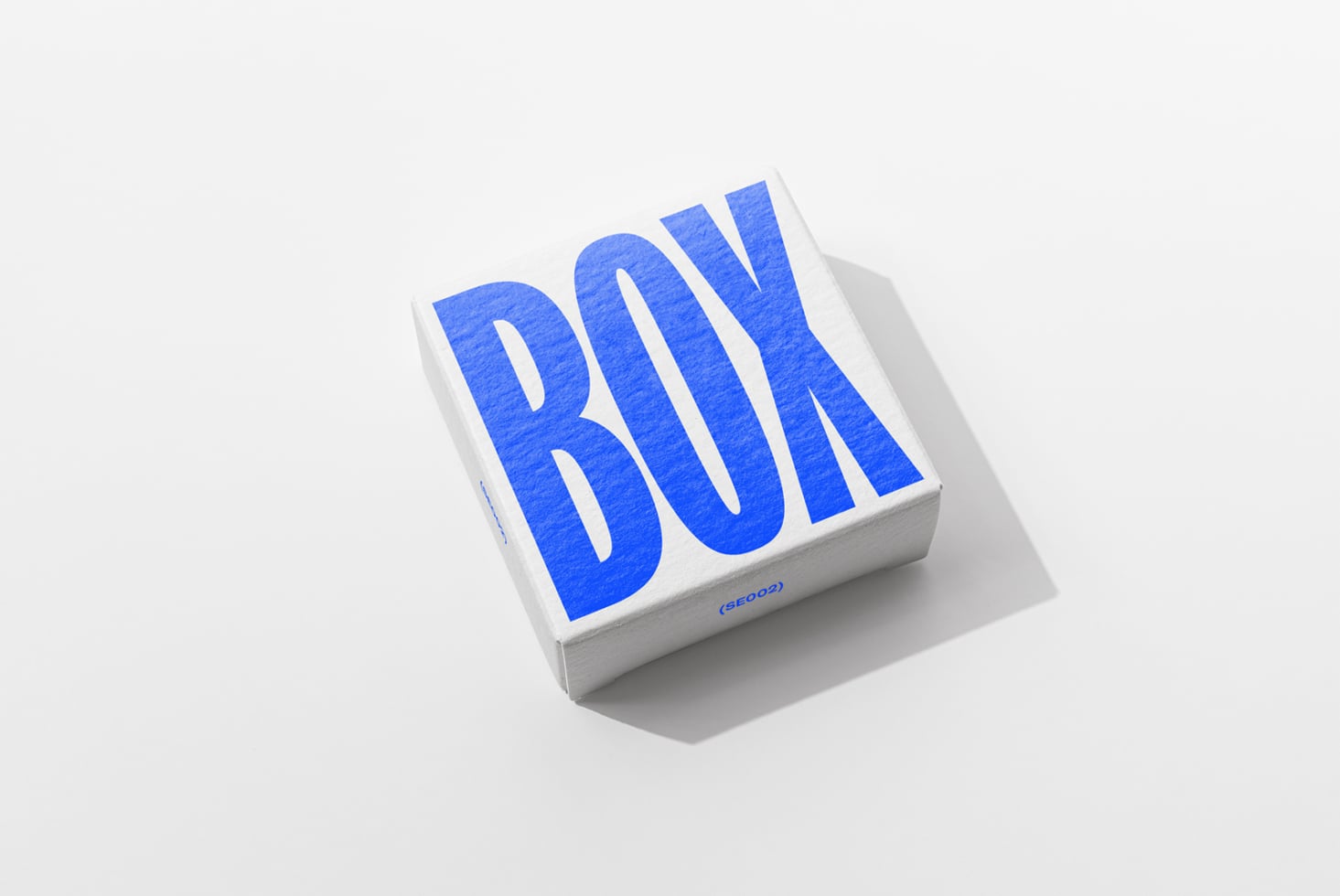 White square box mockup with large blue BOX text, three-quarter view