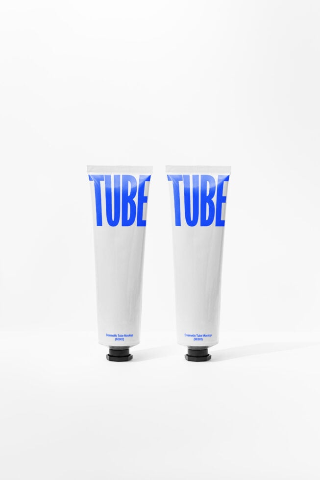 Pair of white cosmetic tubes with bright blue TUBE text labels printed