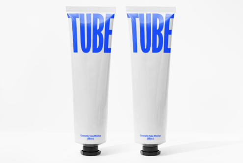 Two white cosmetic tubes with bold blue TUBE text design on labels