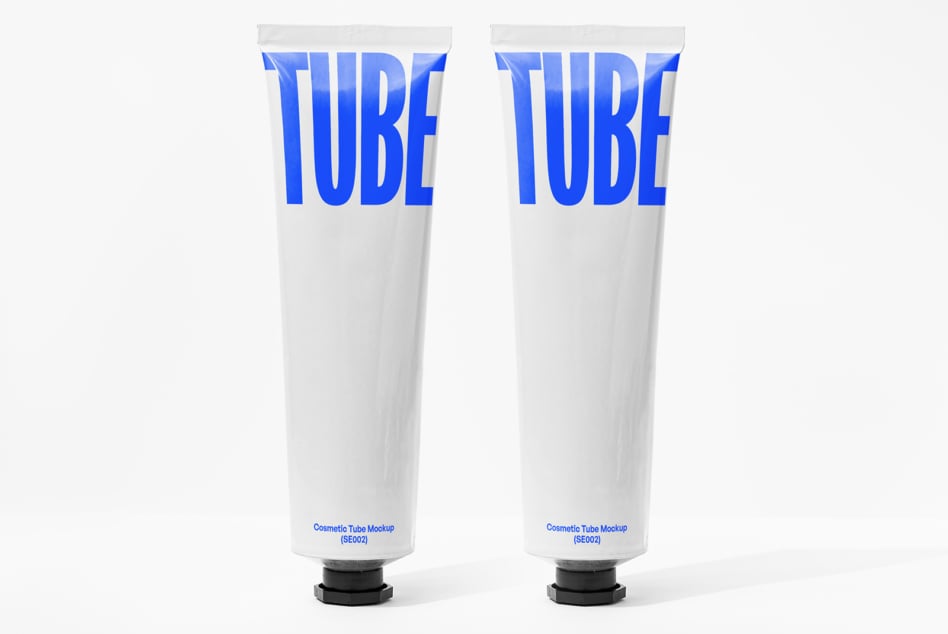 Two white cosmetic tubes with bold blue TUBE text design on labels