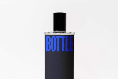 Tall clear bottle with black cap, blue BOTTLE text on dark color-blocked label