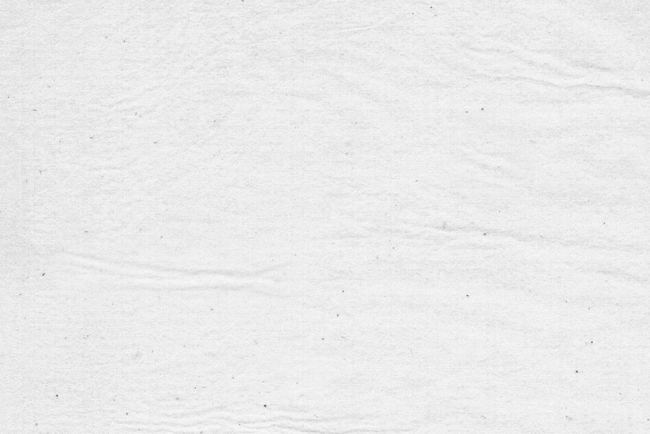 Close-up texture of light gray concrete or stone surface with subtle grain