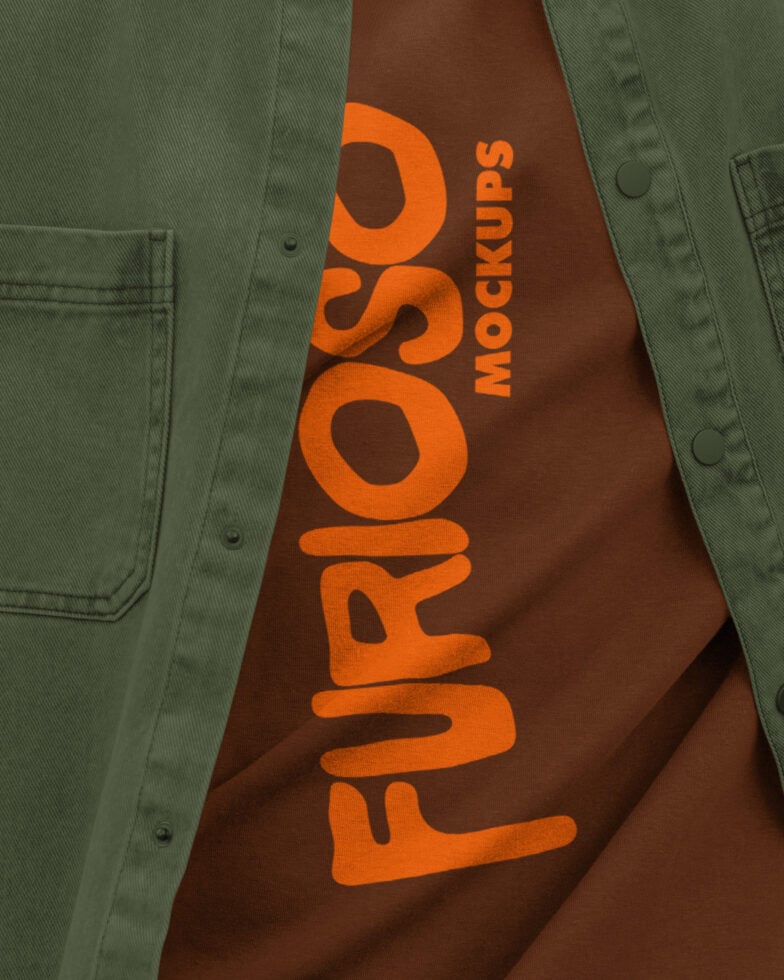 Brown tee with large orange vertical Furioso text, worn under olive green jacket