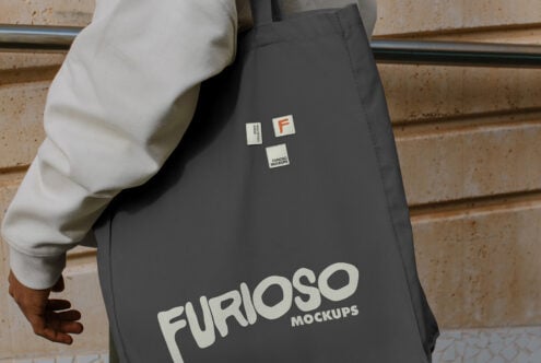 Charcoal tote bag showing cream Furioso Mockups logo with label patch details