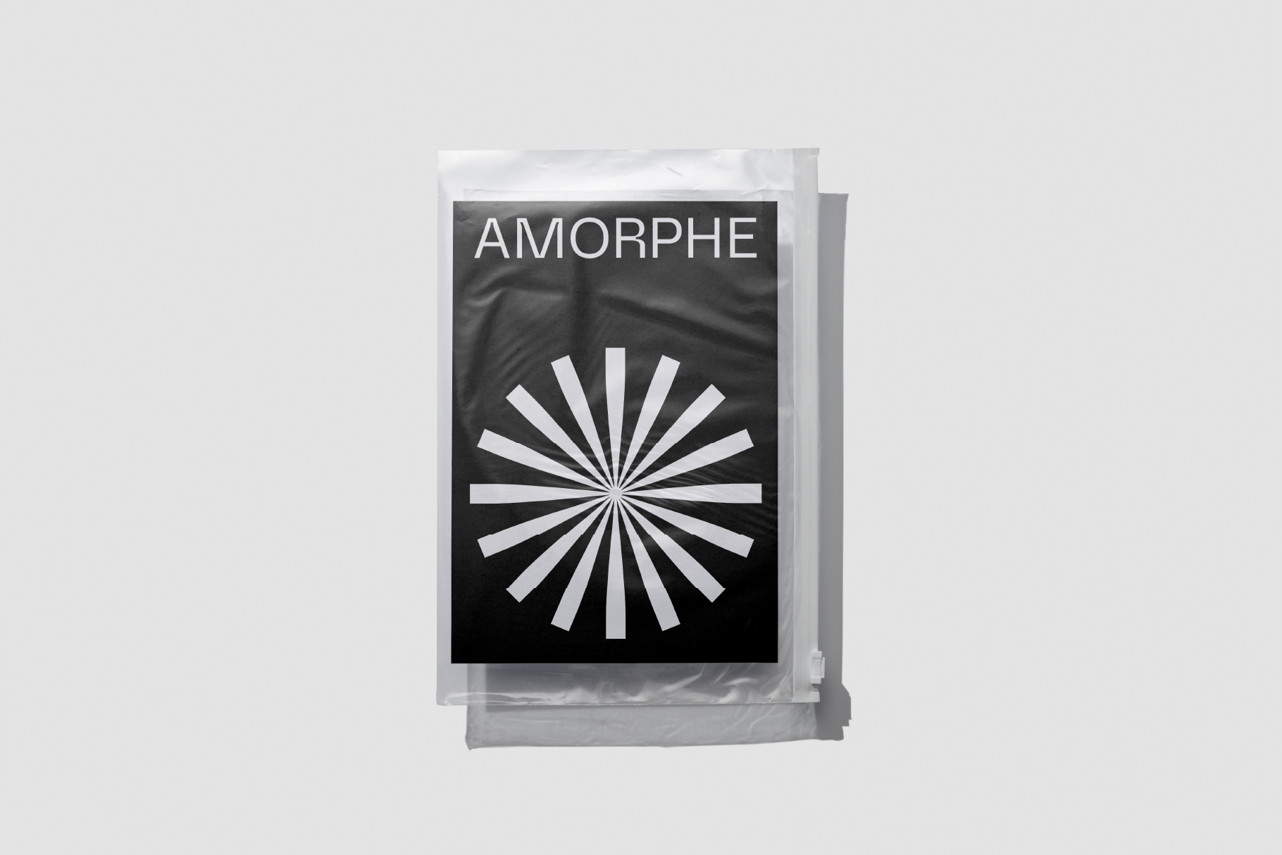 Amorph magazine cover with radiating lines on black background
