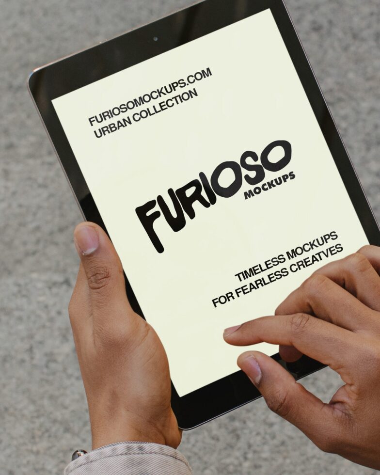 Tablet held at angle showing minimalist cream screen display