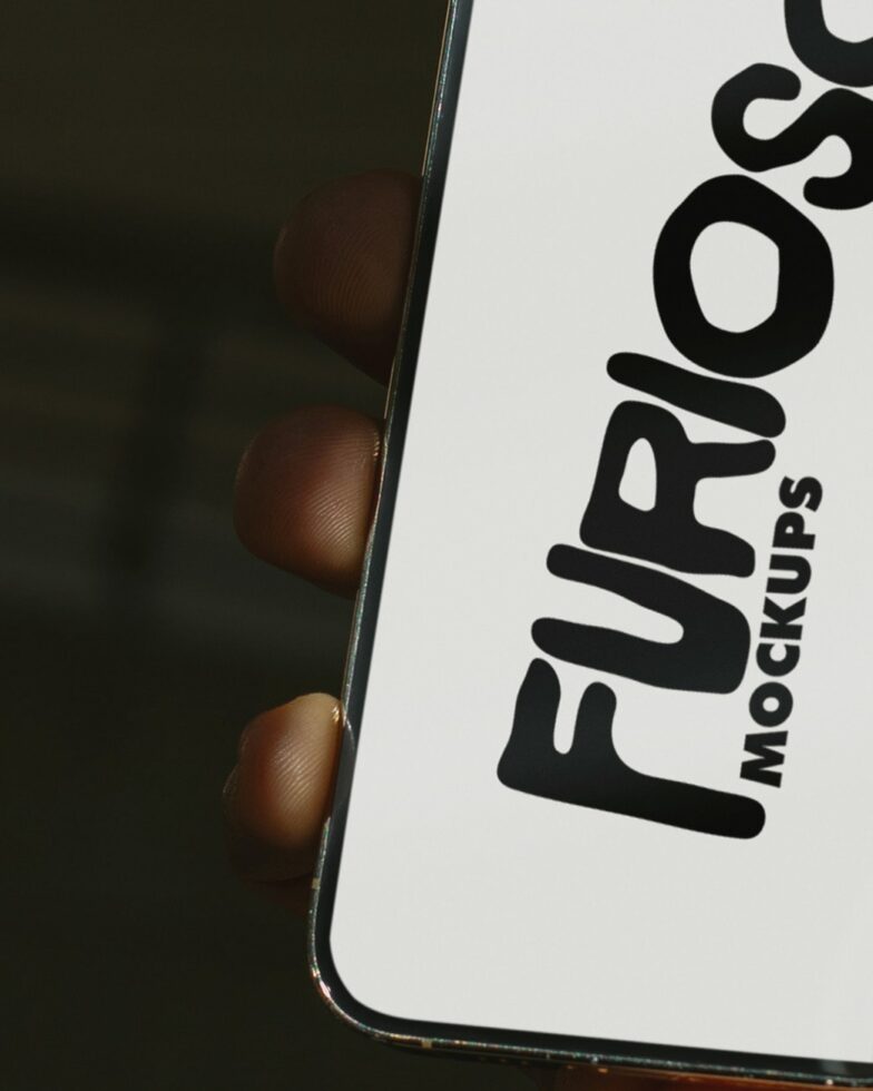 Phone tilted showing orange screen with Furioso Mockups vertical logo text