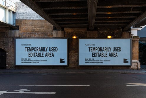 Two large rectangular billboards under bridge, light blue background with dark text